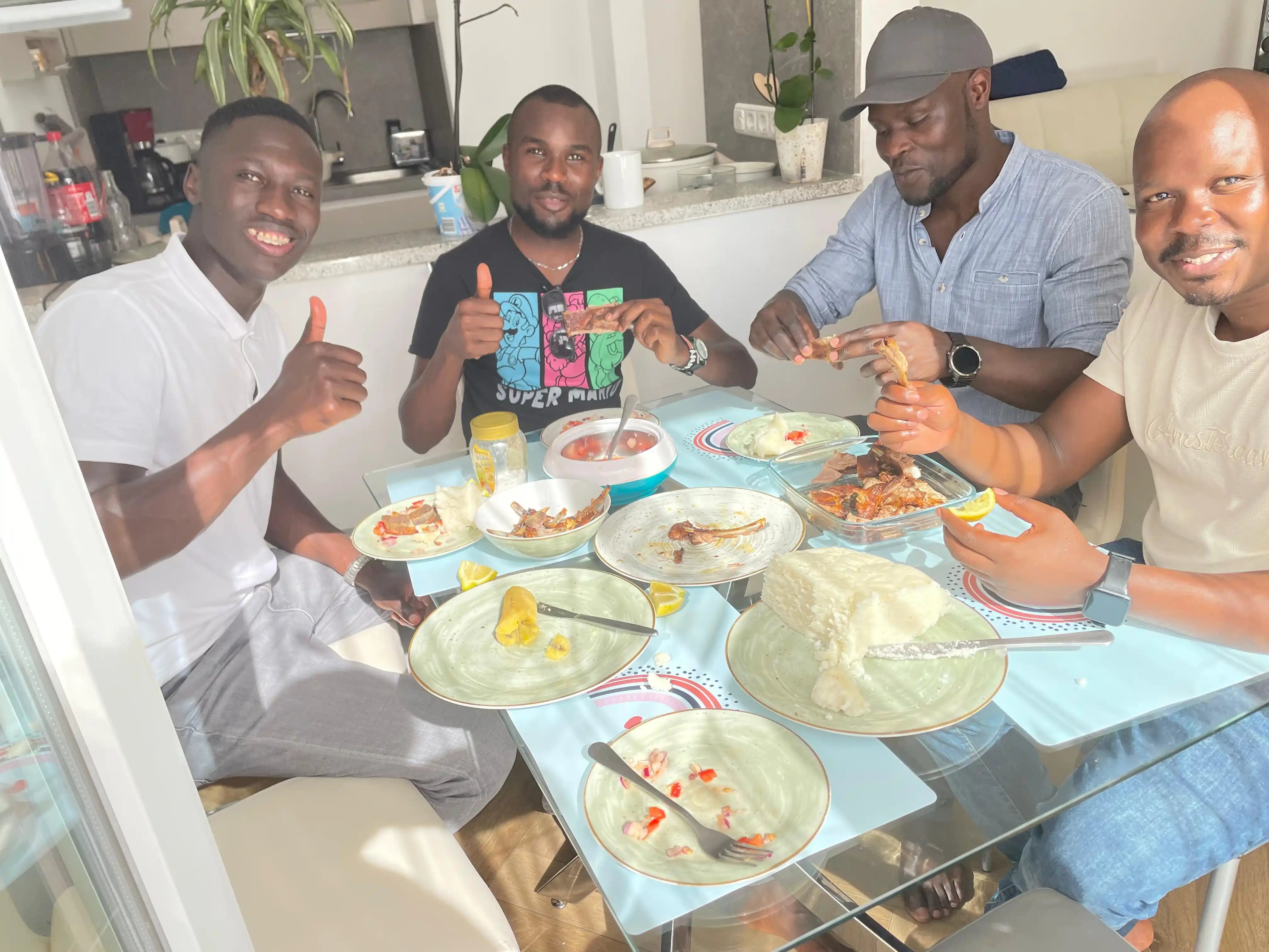 Kenyans eating ugali and nyama choma